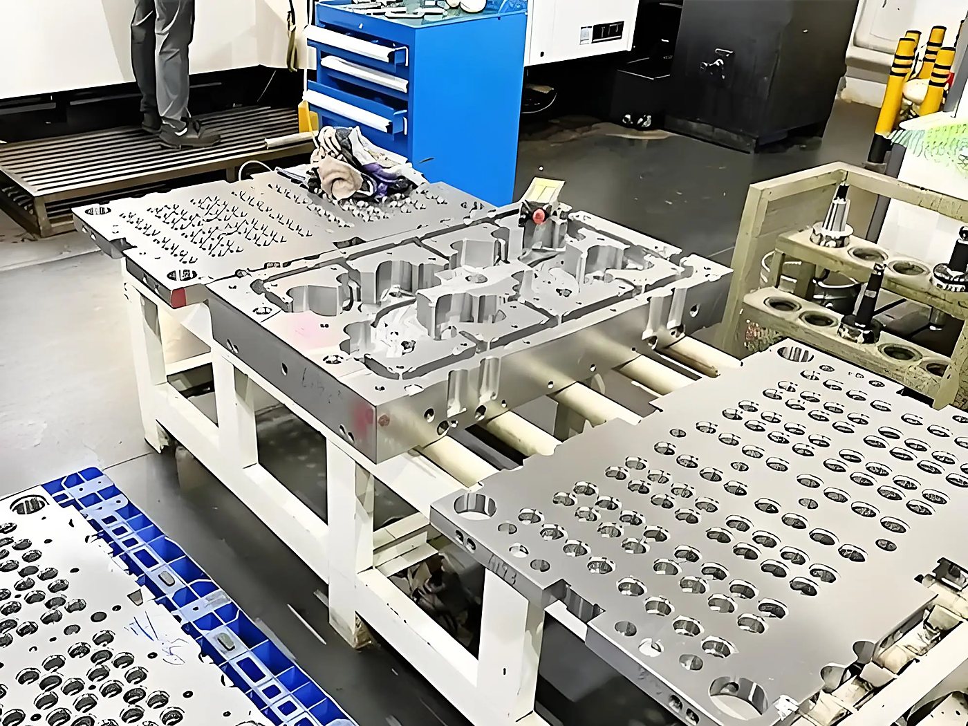 Multi-cavity mould plate being assembled on the bench in the in-house tool room
